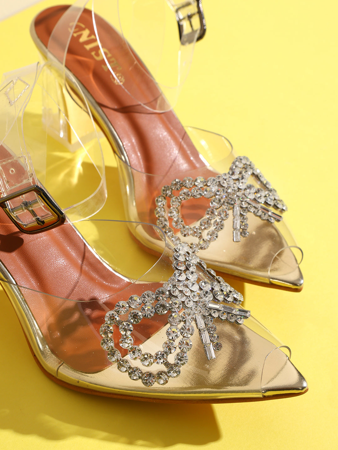 GNIST Gold Pointed Embellished Transparent Bow Heels